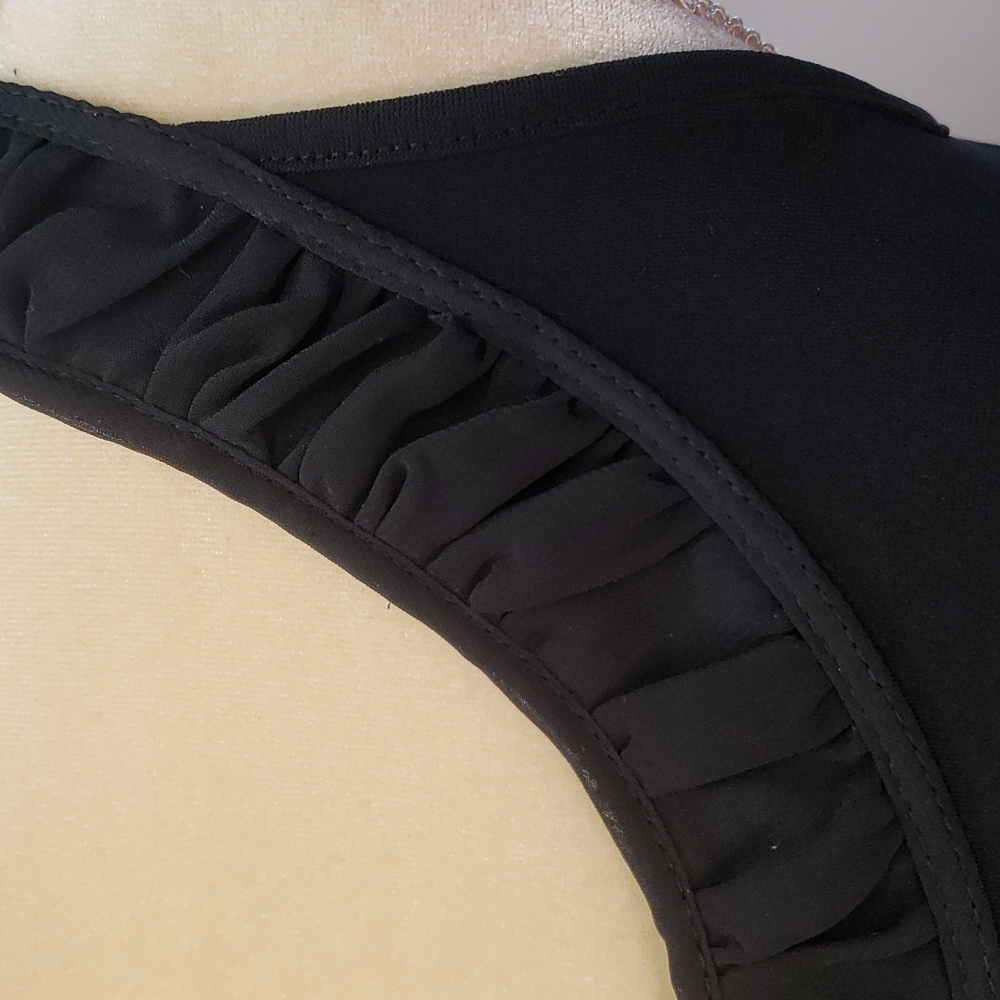 Chico's size 0 black take top.       B54 - Picture 2 of 8